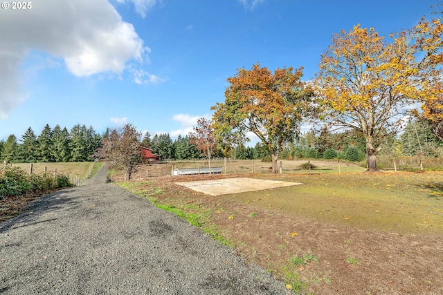 view of yard with a rural view