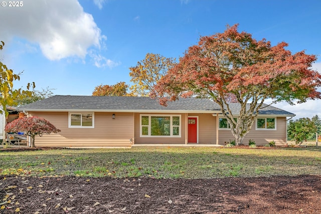 single story home featuring a front yard