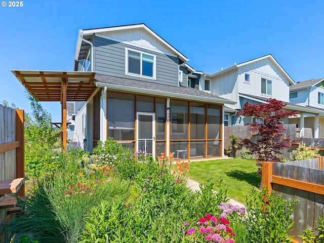 1793 SE Jonathan Ave, Dallas, OR 97338 - back of property with a sunroom, roof with shingles, and board and batten siding