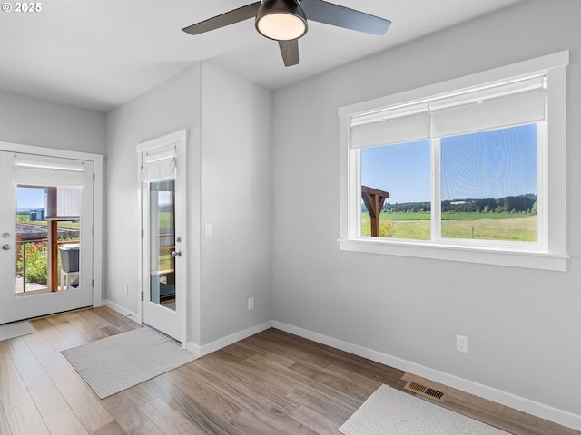 1793 SE Jonathan Ave, Dallas, OR 97338 - foyer entrance featuring healthy amount of natural light, baseboards, a ceiling fan, and wood finished floors