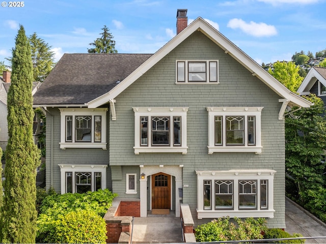 2424 NW Northrup St, Portland, OR 97210 - view of front facade featuring a chimney and a shingled roof