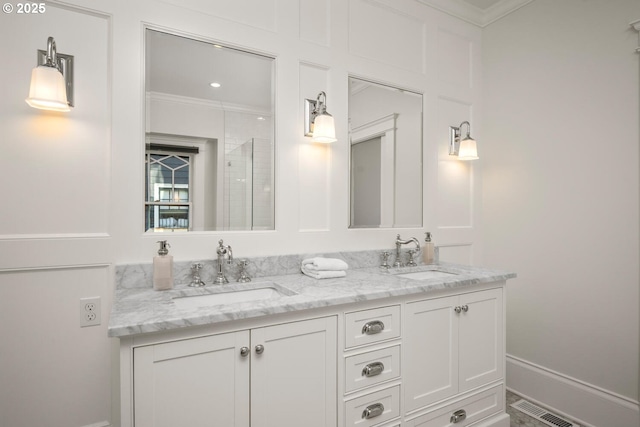 2424 NW Northrup St, Portland, OR 97210 - full bath with ornamental molding, double vanity, and baseboards