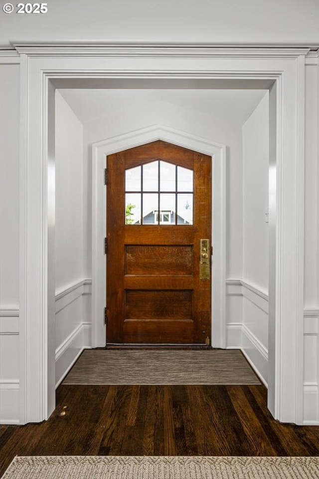 2424 NW Northrup St, Portland, OR 97210 - doorway with a decorative wall, dark wood-style floors, and a wainscoted wall