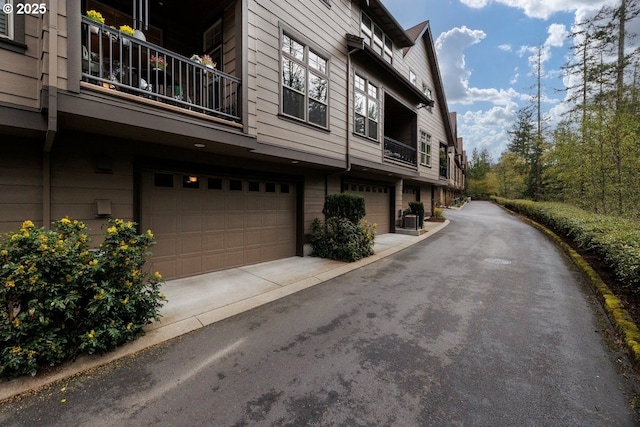 exterior space featuring driveway and an attached garage