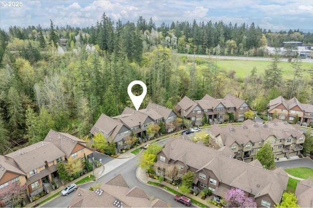aerial view with a residential view and a forest view