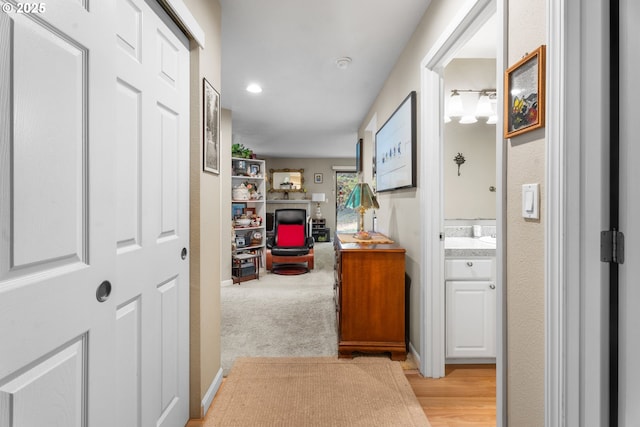 hallway with light colored carpet
