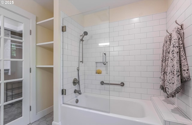 bathroom with  shower combination and baseboards