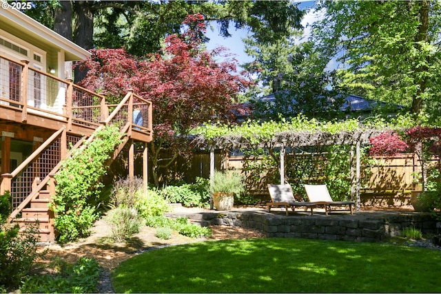 view of yard featuring stairs and a wooden deck