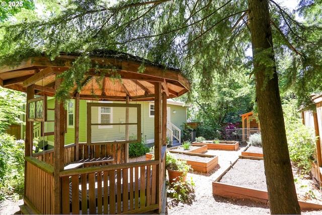 view of outbuilding with a vegetable garden and a gazebo