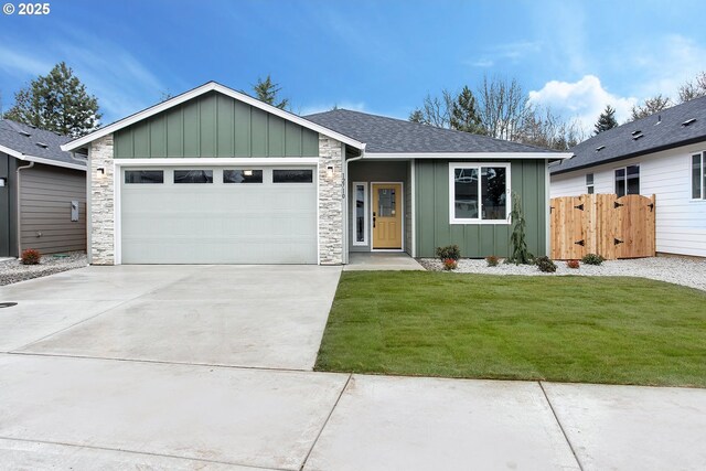 ranch-style home with a garage and a front lawn