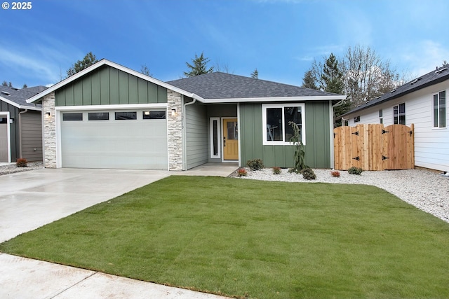 ranch-style home featuring a garage and a front lawn