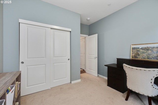 home office with light carpet and baseboards