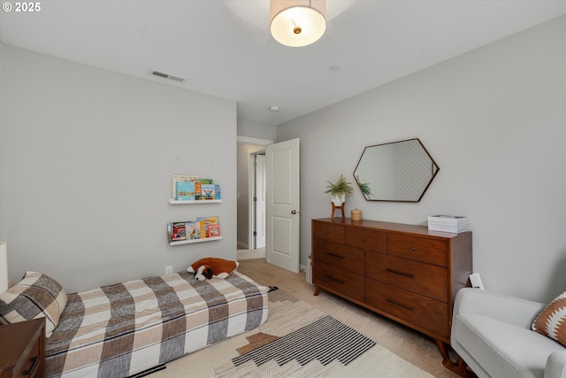 bedroom featuring light colored carpet