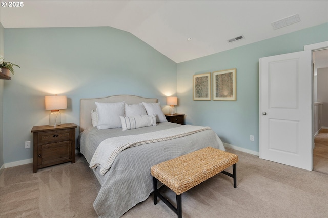 bedroom featuring vaulted ceiling, light colored carpet, and baseboards