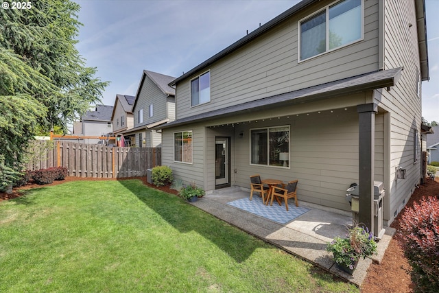 rear view of property featuring a patio area