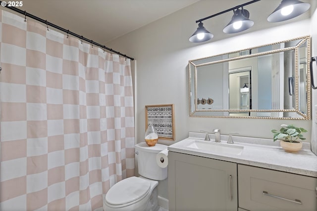 full bathroom featuring vanity, a shower with curtain, and toilet
