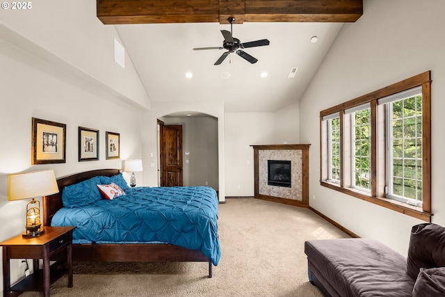 8585 NW Copeland St, Portland, OR 97229 - bedroom featuring high vaulted ceiling, light carpet, baseboards, beamed ceiling, and arched walkways