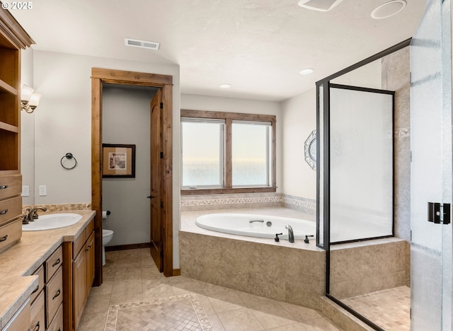 8585 NW Copeland St, Portland, OR 97229 - bathroom featuring vanity, a bath, toilet, and a shower stall