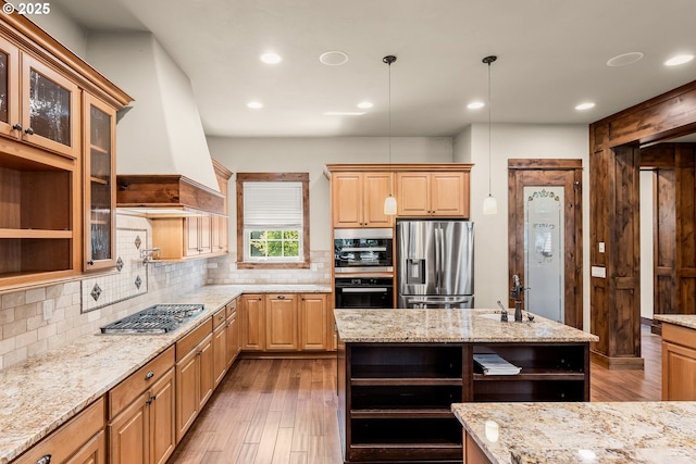 8585 NW Copeland St, Portland, OR 97229 - kitchen with open shelves, stainless steel appliances, backsplash, wood finished floors, and light stone counters