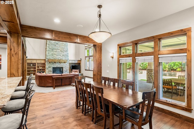 8585 NW Copeland St, Portland, OR 97229 - dining area featuring light wood-type flooring, a fireplace, and recessed lighting