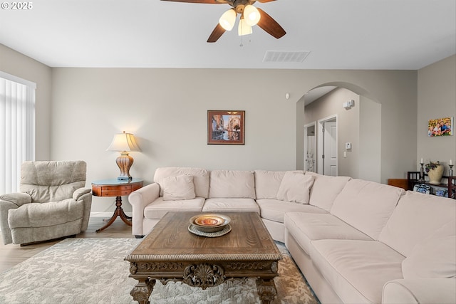 2637 Baines Blvd, Hubbard, OR 97032 - living area with arched walkways, a ceiling fan, and wood finished floors