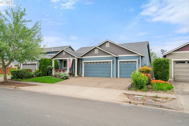 2637 Baines Blvd, Hubbard, OR 97032 - view of front facade featuring a garage, concrete driveway, and a porch