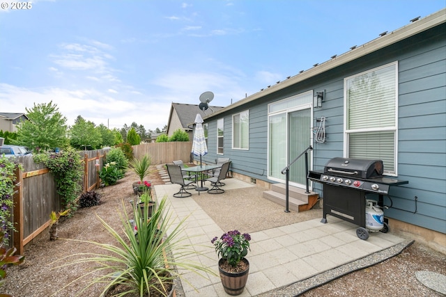 2637 Baines Blvd, Hubbard, OR 97032 - fenced backyard featuring a grill, entry steps, and a patio