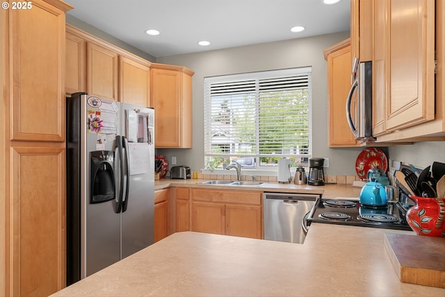 2637 Baines Blvd, Hubbard, OR 97032 - kitchen featuring appliances with stainless steel finishes, light brown cabinetry, recessed lighting, and light countertops
