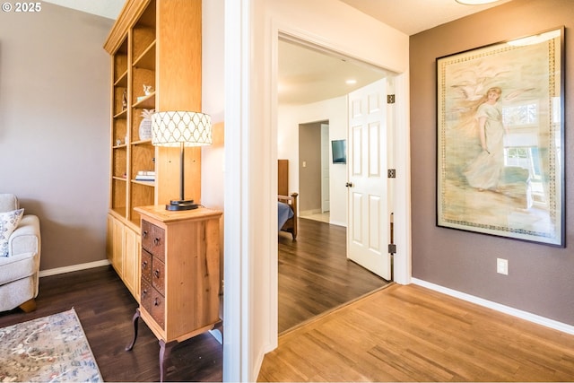 105 Sijota St, Gleneden Beach, OR 97388 - hallway with wood finished floors, baseboards, and built in shelves