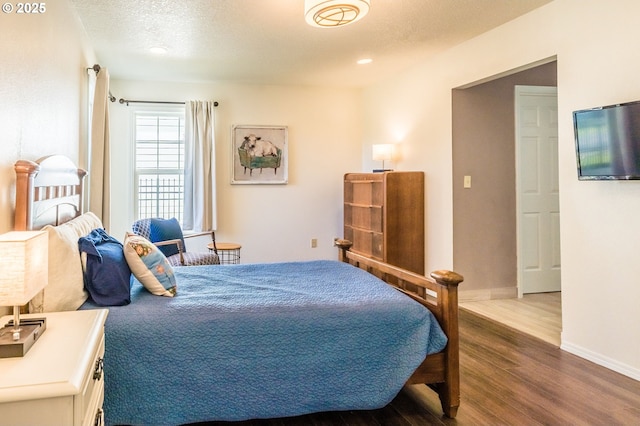 105 Sijota St, Gleneden Beach, OR 97388 - bedroom featuring recessed lighting, dark wood finished floors, baseboards, and a textured ceiling