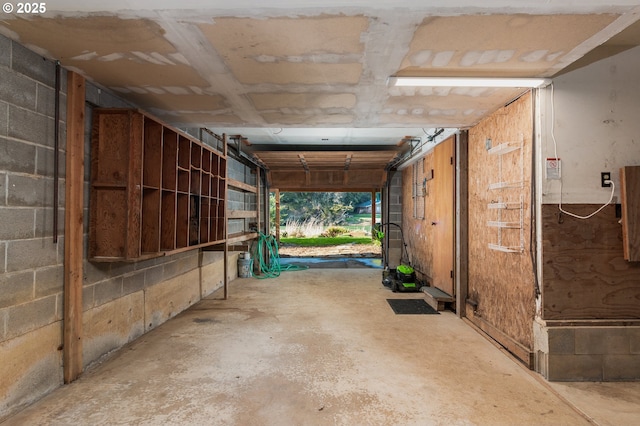 garage with concrete block wall