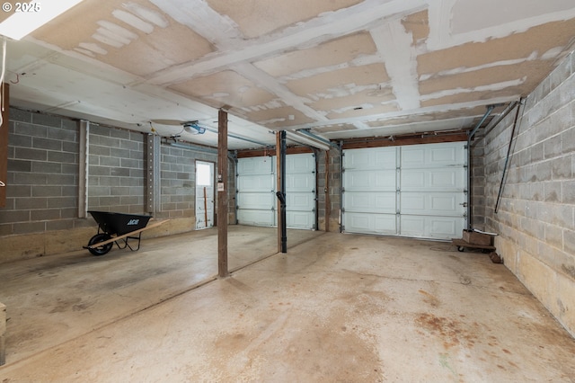 garage featuring concrete block wall