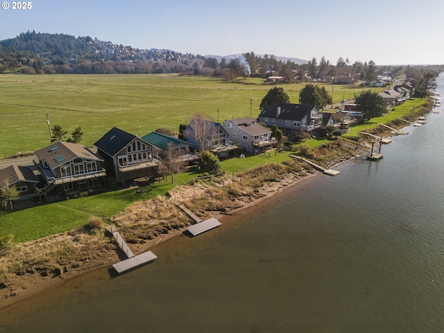 aerial view with a rural view and a water view