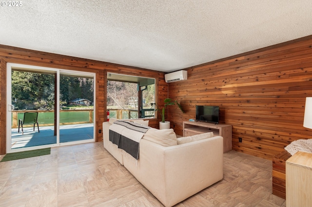 unfurnished living room with a textured ceiling, wood walls, and a wall unit AC