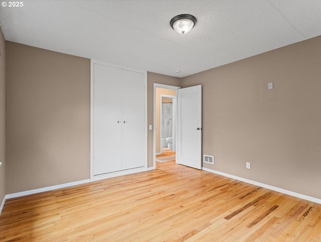 4501 NW Washington St, Vancouver, WA 98663 - unfurnished bedroom featuring baseboards, wood finished floors, and a closet