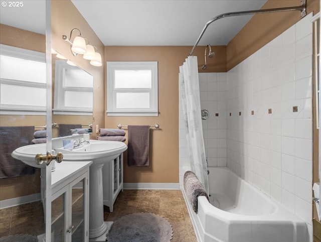 4501 NW Washington St, Vancouver, WA 98663 - bathroom featuring baseboards and shower / bath combo with shower curtain