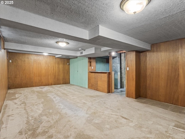 4501 NW Washington St, Vancouver, WA 98663 - finished below grade area featuring a textured ceiling, wood walls, and carpet floors