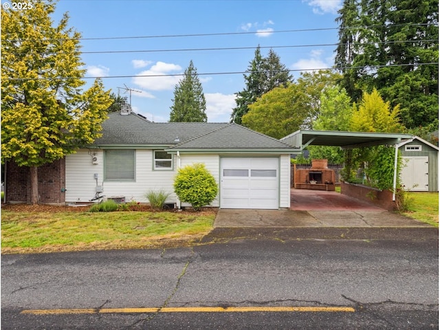 4501 NW Washington St, Vancouver, WA 98663 - garage with a shed, a carport, and driveway