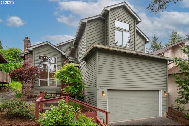 5002 SW Vacuna St, Portland, OR 97219 - mid-century inspired home with a garage and asphalt driveway
