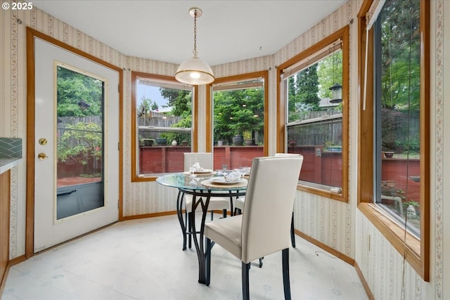 5002 SW Vacuna St, Portland, OR 97219 - sunroom / solarium featuring wallpapered walls, plenty of natural light, baseboards, and tile patterned floors