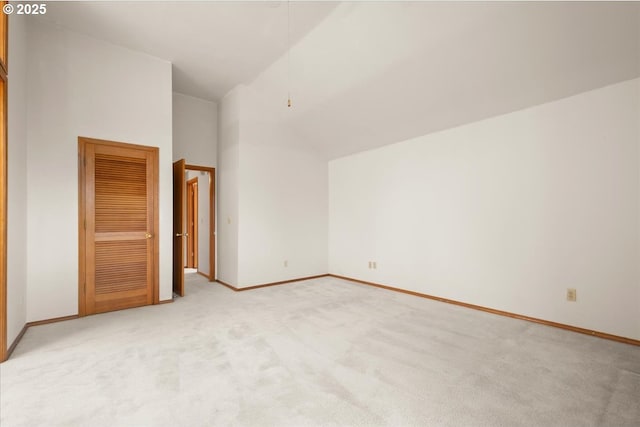 5002 SW Vacuna St, Portland, OR 97219 - bonus room featuring light colored carpet, baseboards, and high vaulted ceiling