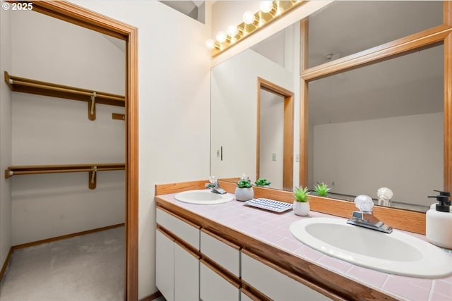 5002 SW Vacuna St, Portland, OR 97219 - bathroom with double vanity and a walk in closet
