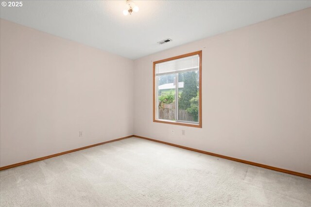 5002 SW Vacuna St, Portland, OR 97219 - empty room featuring light colored carpet and baseboards