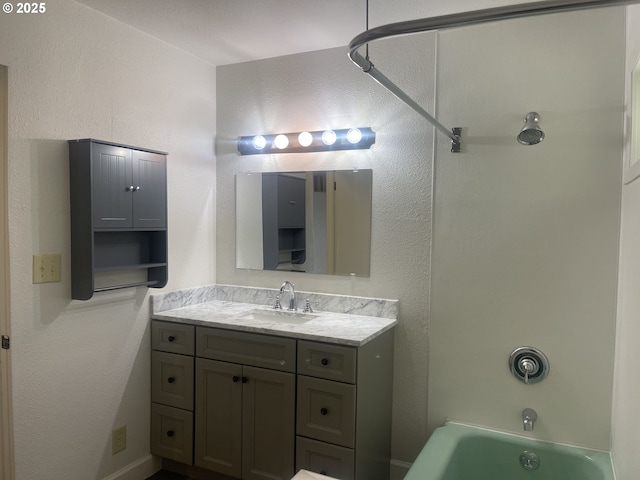 bathroom with vanity and bathing tub / shower combination