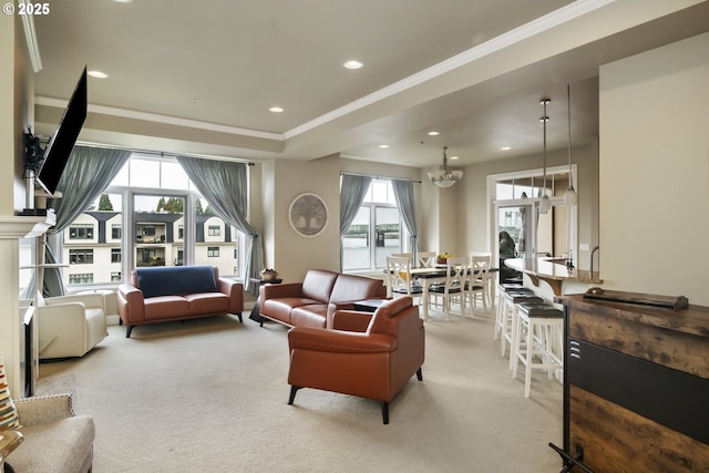 707 N Hayden Island Dr Unit 413, Portland, OR 97217 - living room featuring recessed lighting, light carpet, crown molding, and a wealth of natural light