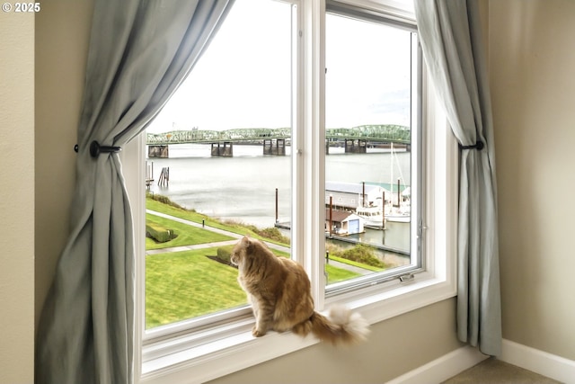 707 N Hayden Island Dr Unit 413, Portland, OR 97217 - doorway to outside featuring a water view and baseboards