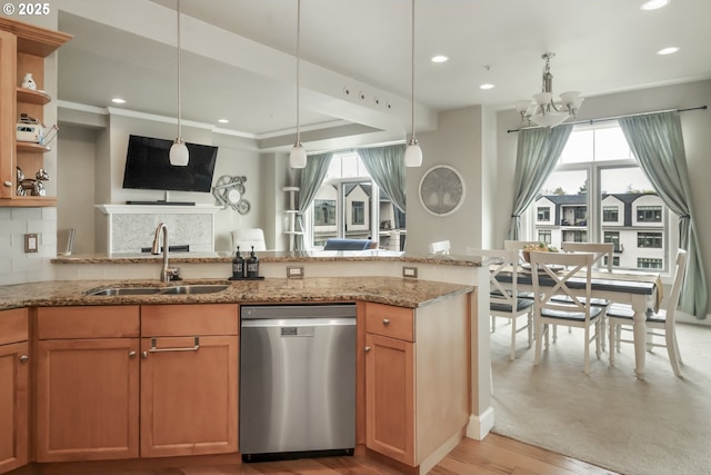 707 N Hayden Island Dr Unit 413, Portland, OR 97217 - kitchen with a peninsula, a sink, a notable chandelier, light wood-style floors, and dishwasher