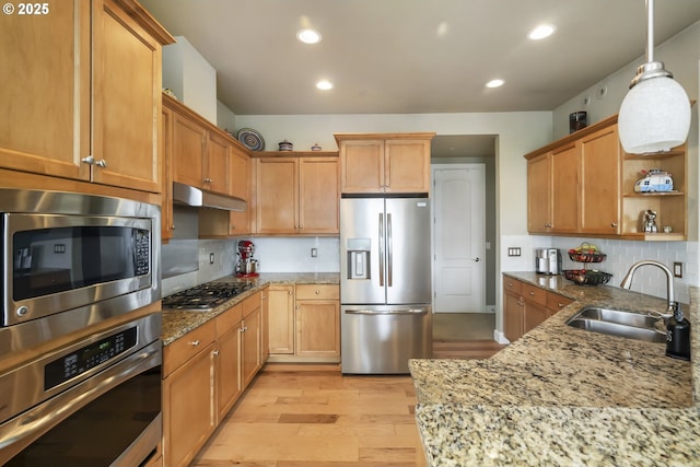 707 N Hayden Island Dr Unit 413, Portland, OR 97217 - kitchen featuring tasteful backsplash, open shelves, a sink, stainless steel appliances, and light wood-style flooring