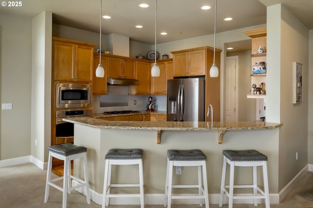 707 N Hayden Island Dr Unit 413, Portland, OR 97217 - kitchen featuring stainless steel appliances, a peninsula, baseboards, and recessed lighting