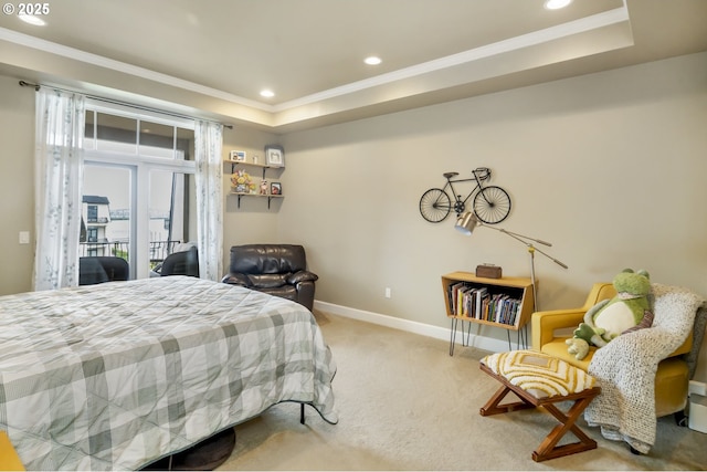 707 N Hayden Island Dr Unit 413, Portland, OR 97217 - bedroom featuring recessed lighting, a tray ceiling, access to exterior, baseboards, and carpet flooring